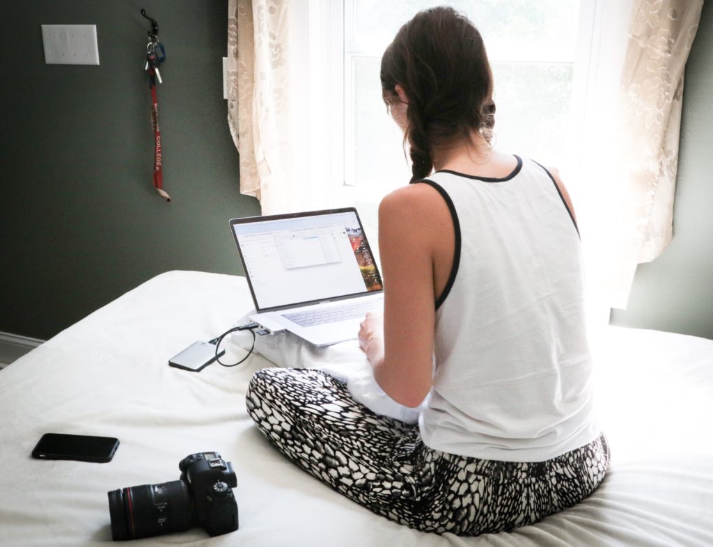 Using a laptop on a bed